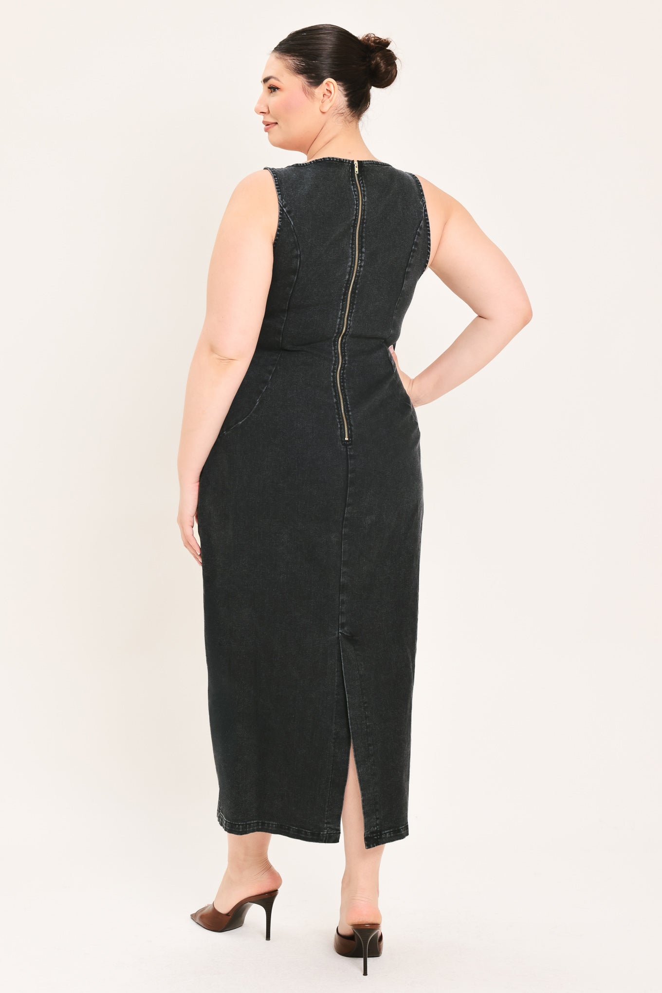 A woman modeling a black sleeveless midi dress with a square neckline | Plus Curve Flying Tomato