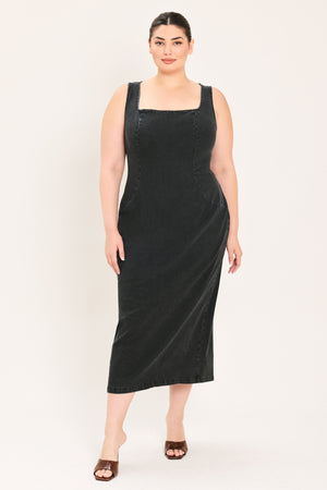 A woman modeling a black sleeveless midi dress with a square neckline | Plus Curve Flying Tomato