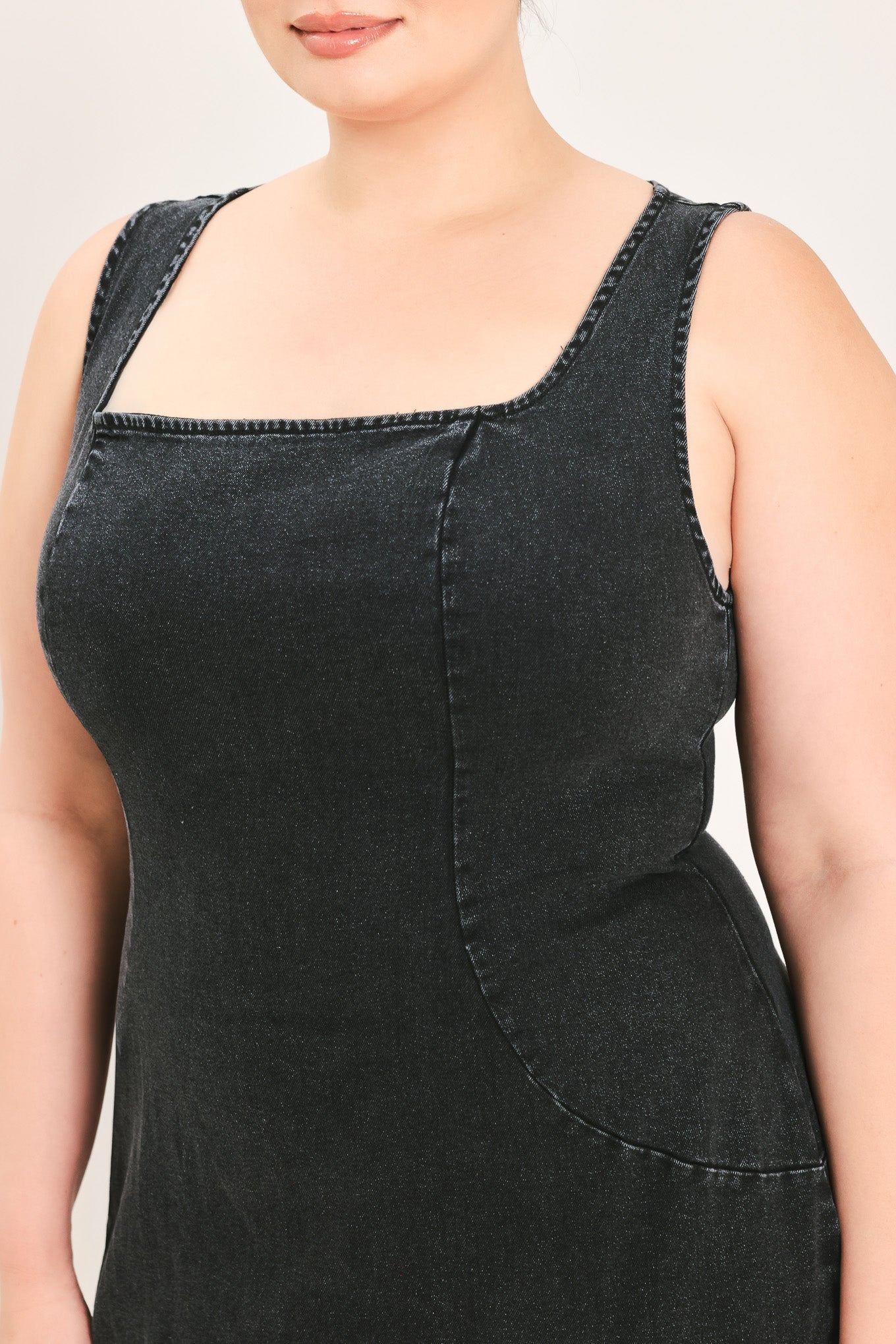 A woman modeling a black sleeveless midi dress with a square neckline | Plus Curve Flying Tomato
