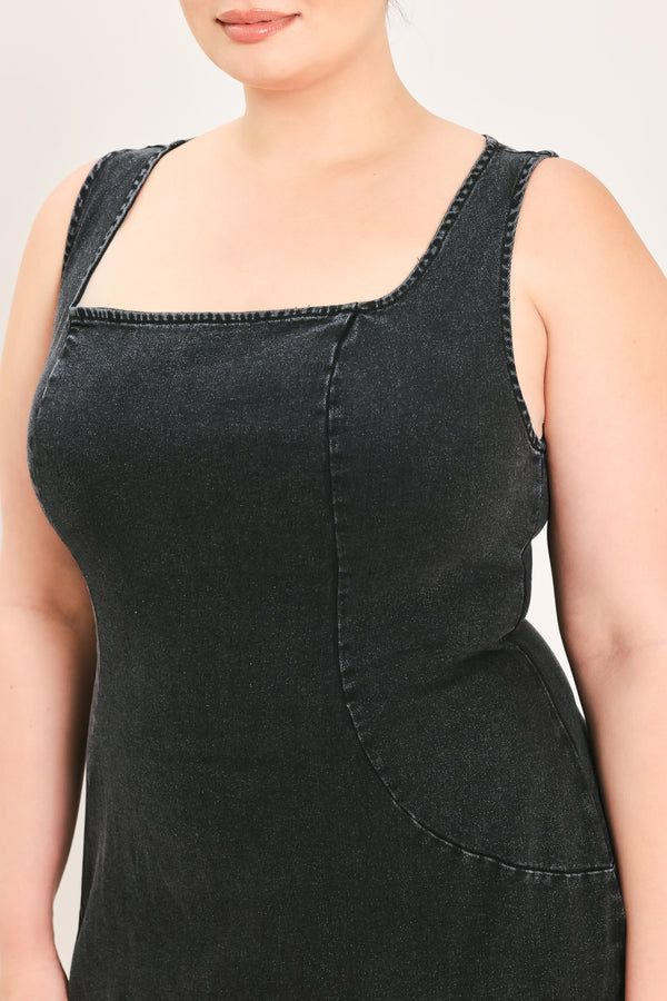 A woman modeling a black sleeveless midi dress with a square neckline | Plus Curve Flying Tomato