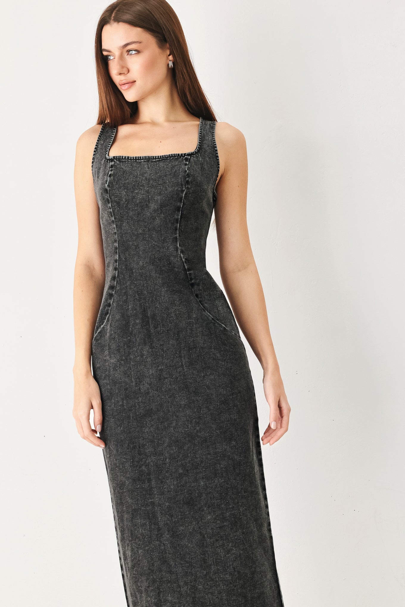 Woman wearing a washed black denim midi dress featuring square neckline, sleeveless and back zipper closure | FREEMARKET