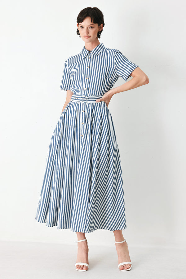 Woman wearing a denim blue and white striped midi shirt dress with self belt and full skirt | FREEMARKET