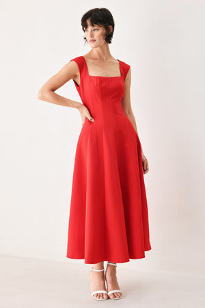 Woman wearing a red midi dress featuring square neckline, cap sleeve, circle skirt and back zipper closure | FREEMARKET