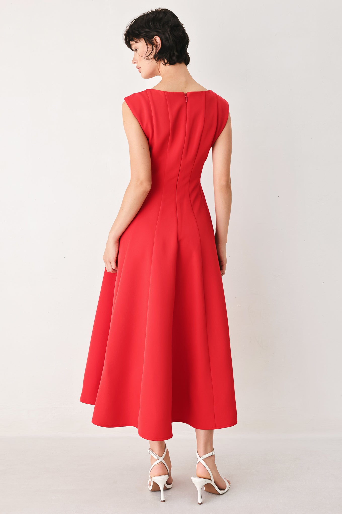 Woman wearing a red midi dress featuring square neckline, cap sleeve, circle skirt and back zipper closure | FREEMARKET