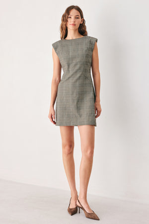 A woman wearing a sleeveless, min gray plaid dress with structured shoulders | FREEMARKET