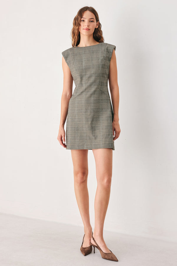A woman wearing a sleeveless, min gray plaid dress with structured shoulders | FREEMARKET