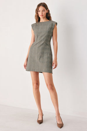 A woman wearing a sleeveless, min gray plaid dress with structured shoulders | FREEMARKET