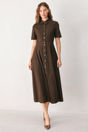 A woman modeling a dark brown short-sleeve midi shirt dress with a button-down front and a defined waist seam | FREEMARKET
