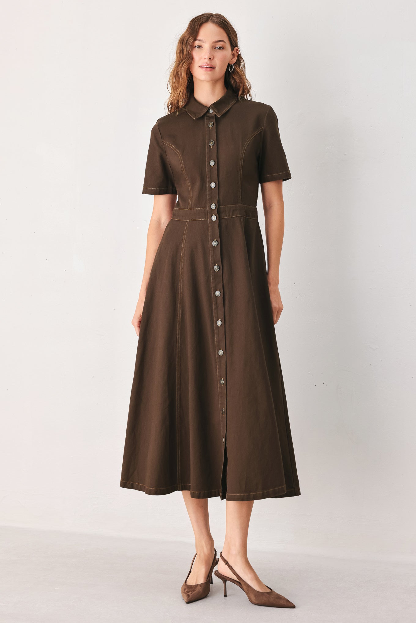 A woman modeling a dark brown short-sleeve midi shirt dress with a button-down front and a defined waist seam | FREEMARKET