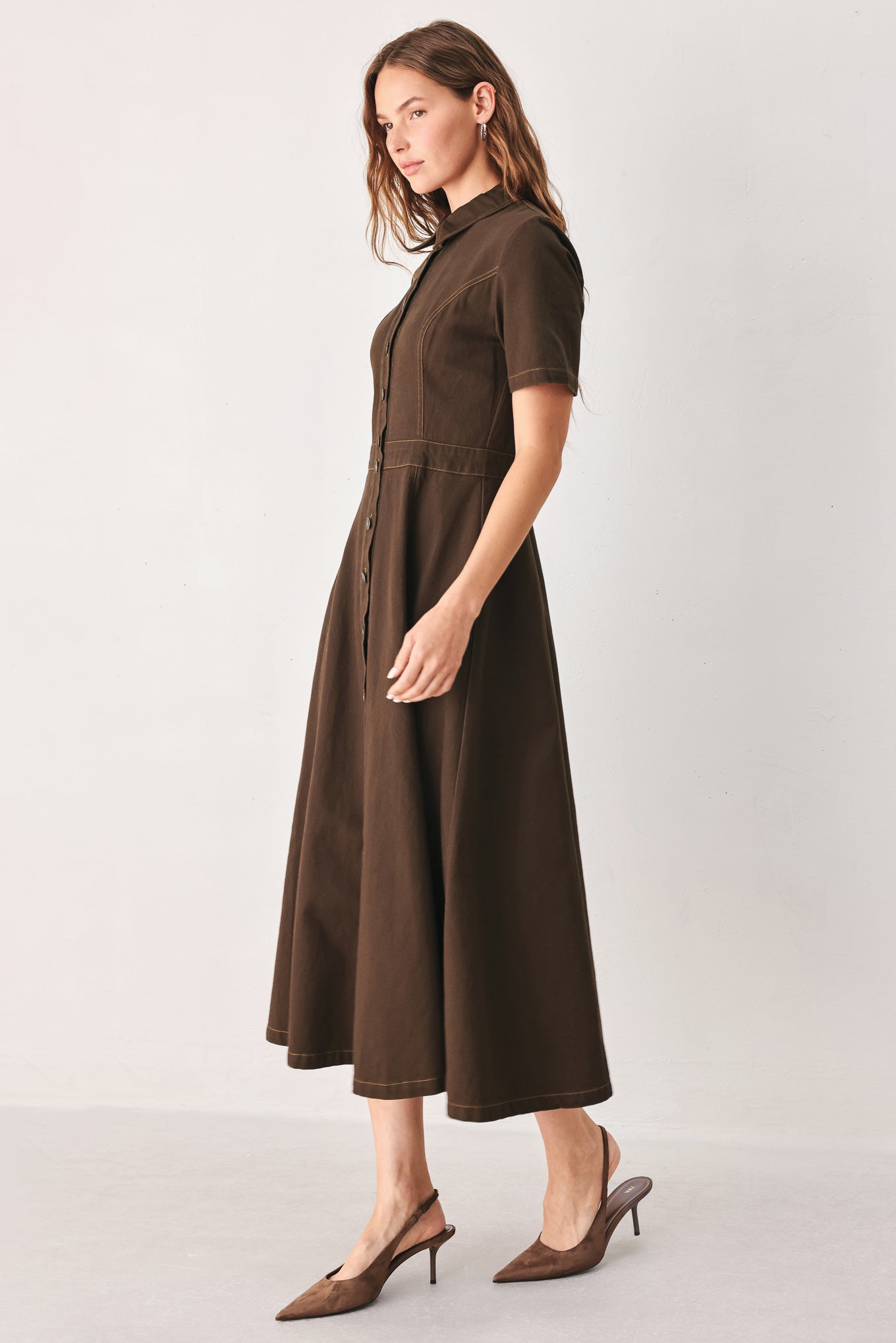 A woman modeling a dark brown short-sleeve midi shirt dress with a button-down front and a defined waist seam | FREEMARKET