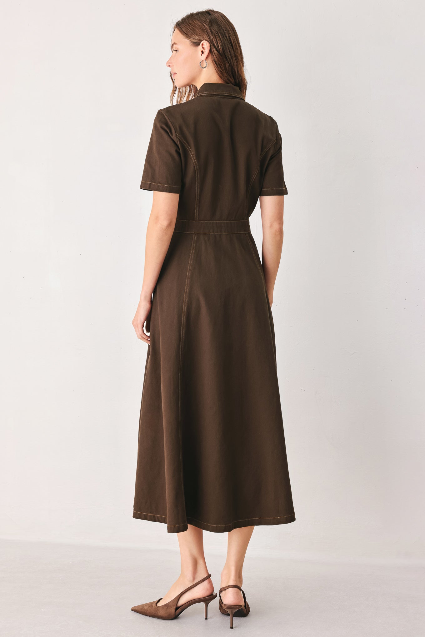 A woman modeling a dark brown short-sleeve midi shirt dress with a button-down front and a defined waist seam | FREEMARKET