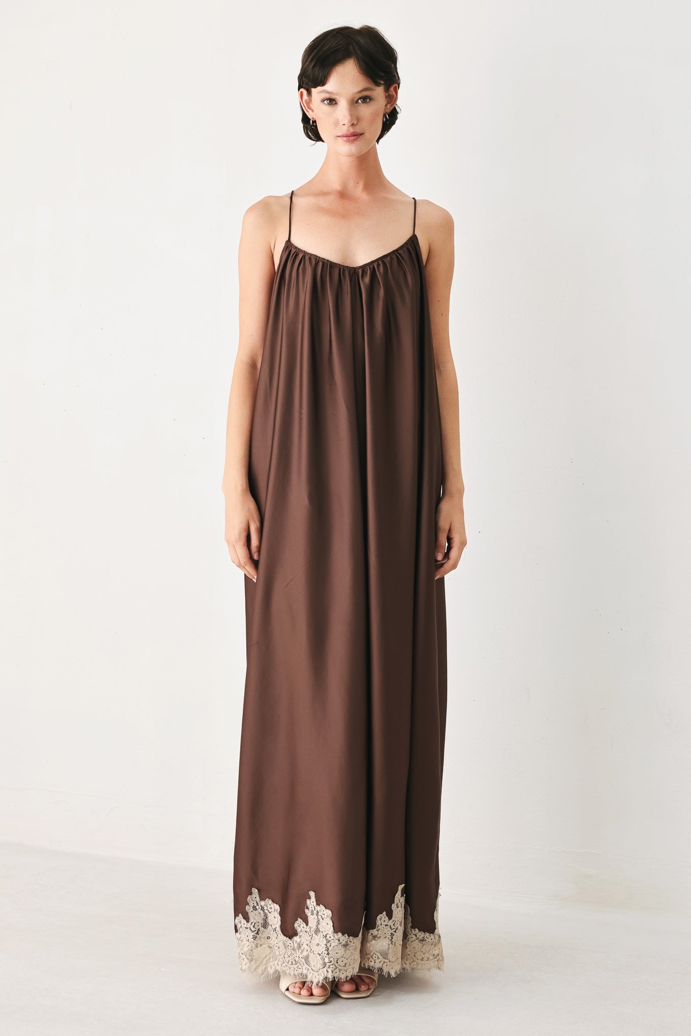 Woman wearing a brown slip dress with cream lace trim | FREEMARKET