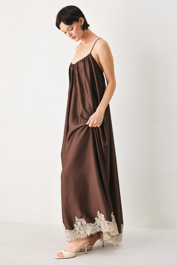 Woman wearing a brown slip dress with cream lace trim | FREEMARKET