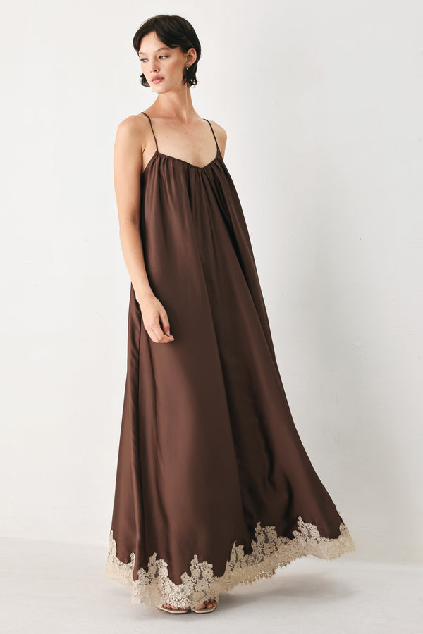 Woman wearing a brown slip dress with cream lace trim | FREEMARKET