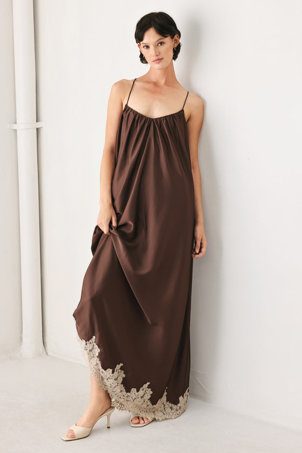 Woman wearing a brown slip dress with cream lace trim | FREEMARKET