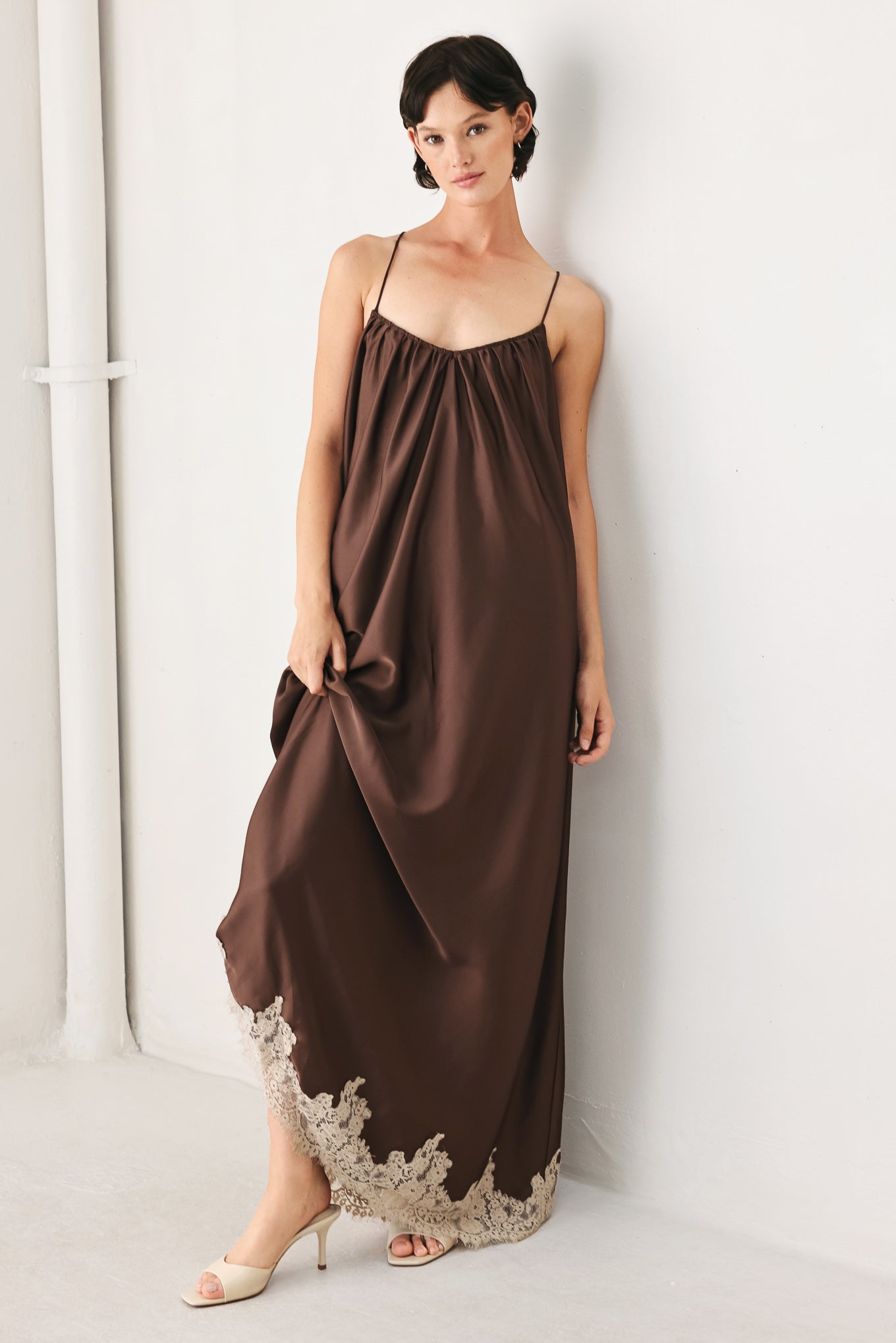 Woman wearing a brown slip dress with cream lace trim | FREEMARKET