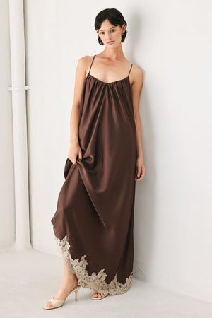 Woman wearing a brown slip dress with cream lace trim | FREEMARKET