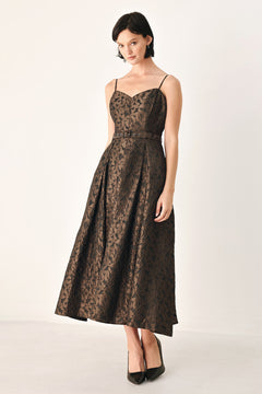 A woman modeling a sleeveless midi dress with thin straps, a sweetheart neckline, and a fitted waist. The dress has an allover dark brown and black floral jacquard pattern | FREEMARKET