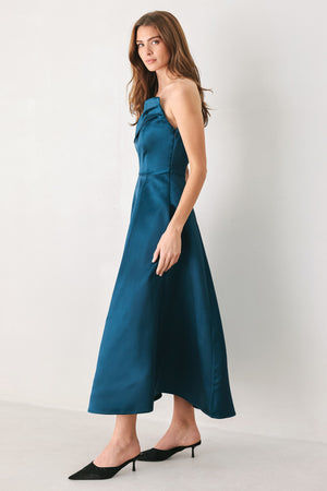 Woman wearing a strapless satin-like teal midi dress with asymmetrical neckline | FREEMARKET