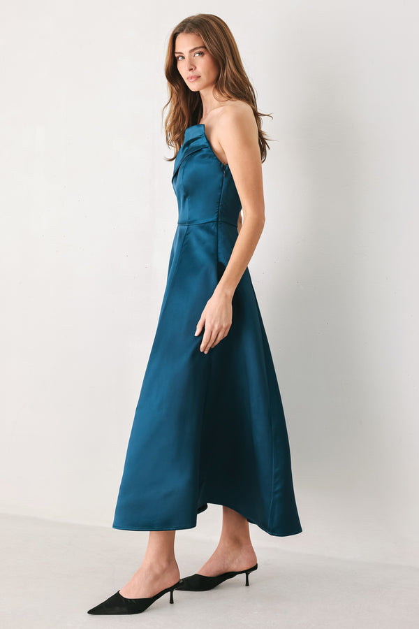 Woman wearing a strapless satin-like teal midi dress with asymmetrical neckline | FREEMARKET