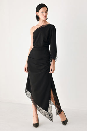 A model wearing a black one-shoulder midi dress with lace trim on the sleeve and hem | FREEMARKET