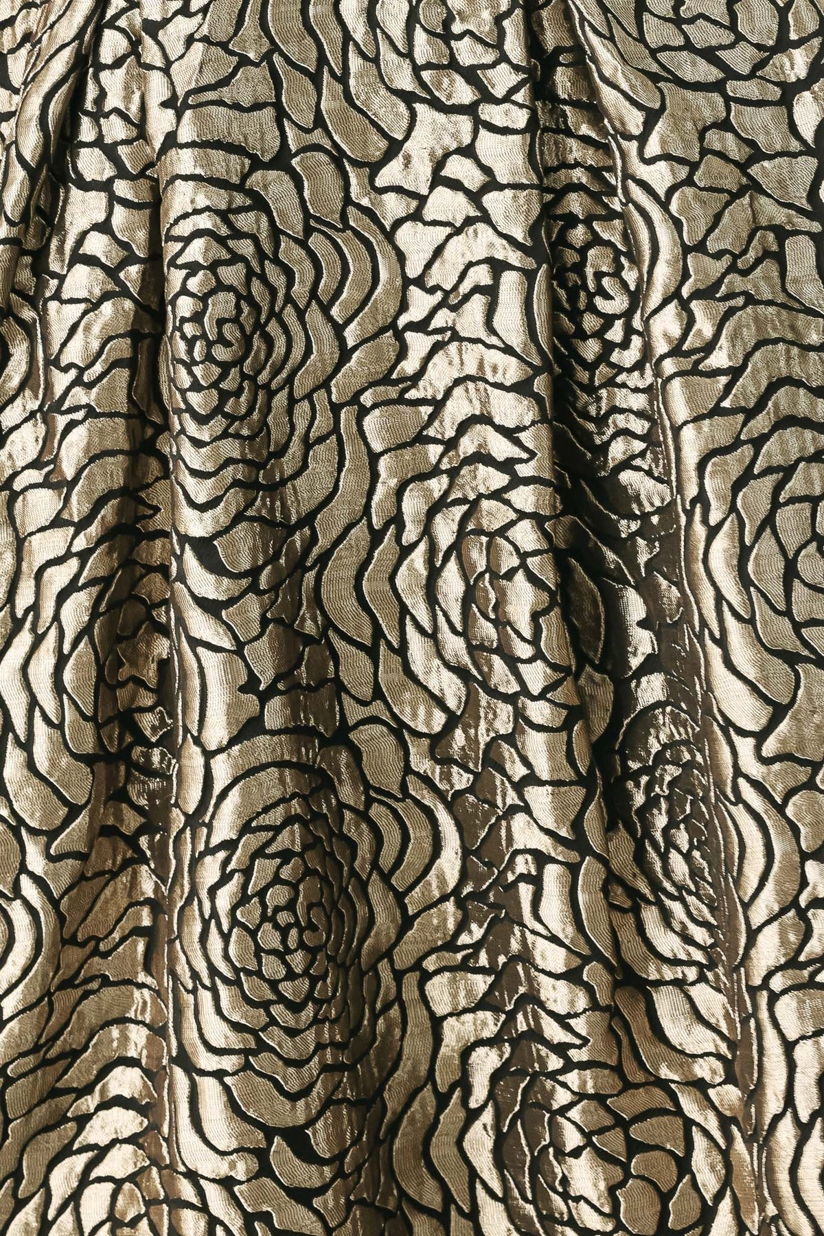 A woman models a strapless midi dress with a black and metallic gold floral pattern | FREEMARKET