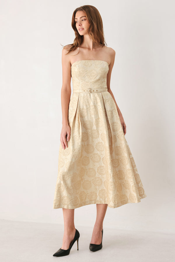 Woman wearing a strapless gold jacquard floral midi dress with a matching waist belt | FREEMARKET