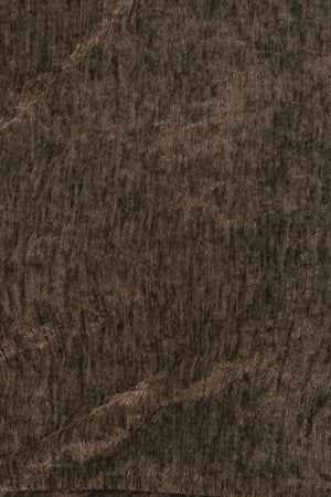 Woman wearing a brown sleeveless chenille midi dress with side ruching and asymmetrical hemline | FREEMARKET