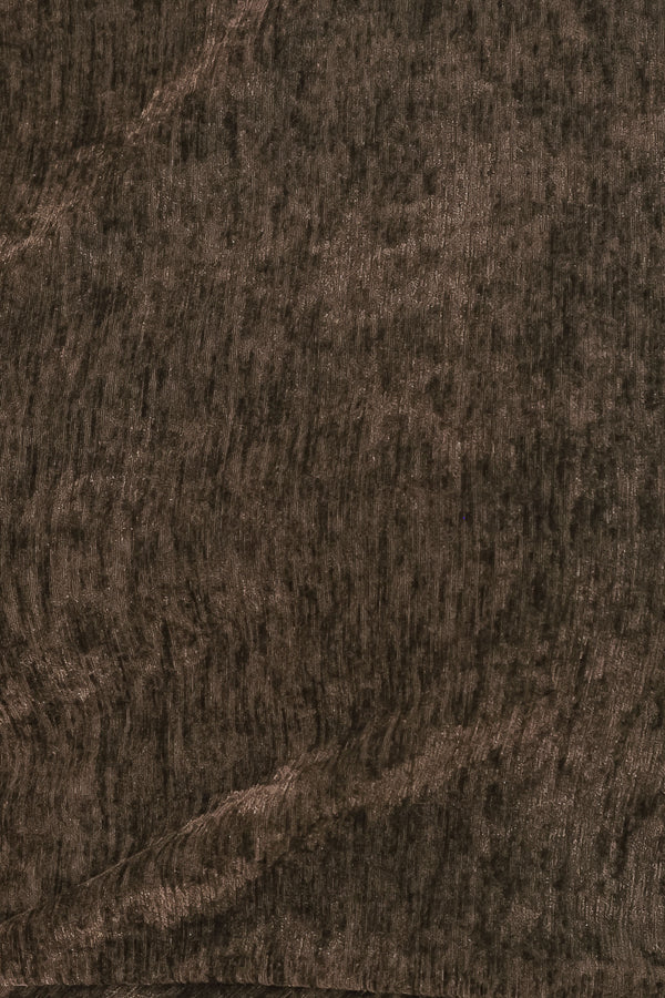Woman wearing a brown sleeveless chenille midi dress with side ruching and asymmetrical hemline | FREEMARKET