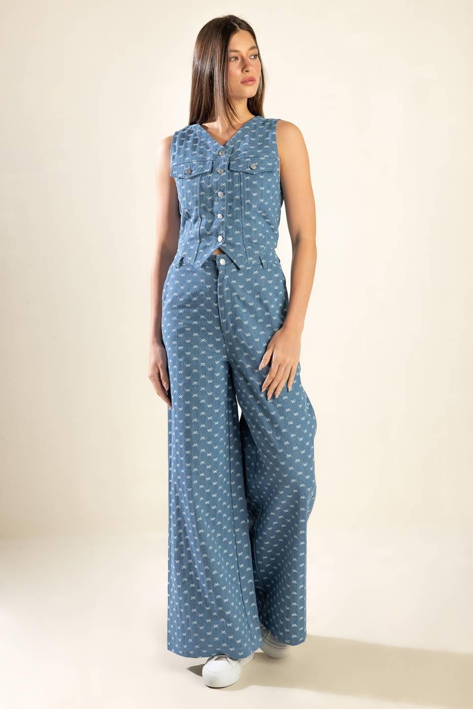 A textured woven vest featuring sleeveless and front button closure.