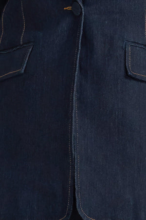 A denim blazer with single button closure and slit at sleeve