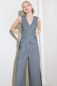 A grey striped woven vest with front button down.