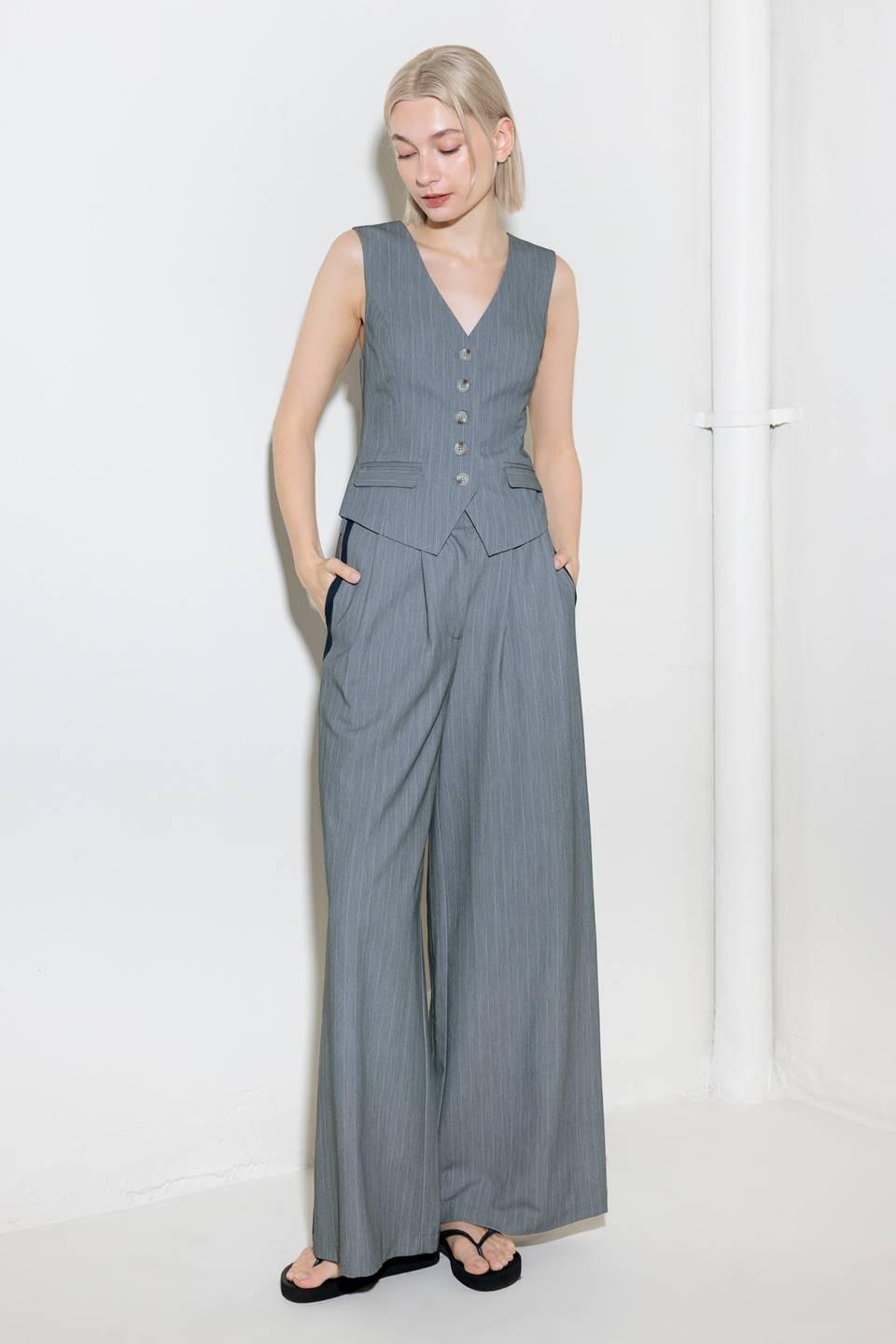 A grey striped woven vest with front button down.