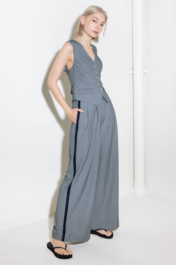 A grey striped woven vest with front button down.
