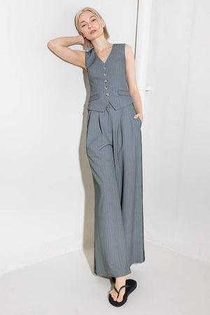 A grey striped woven vest with front button down.
