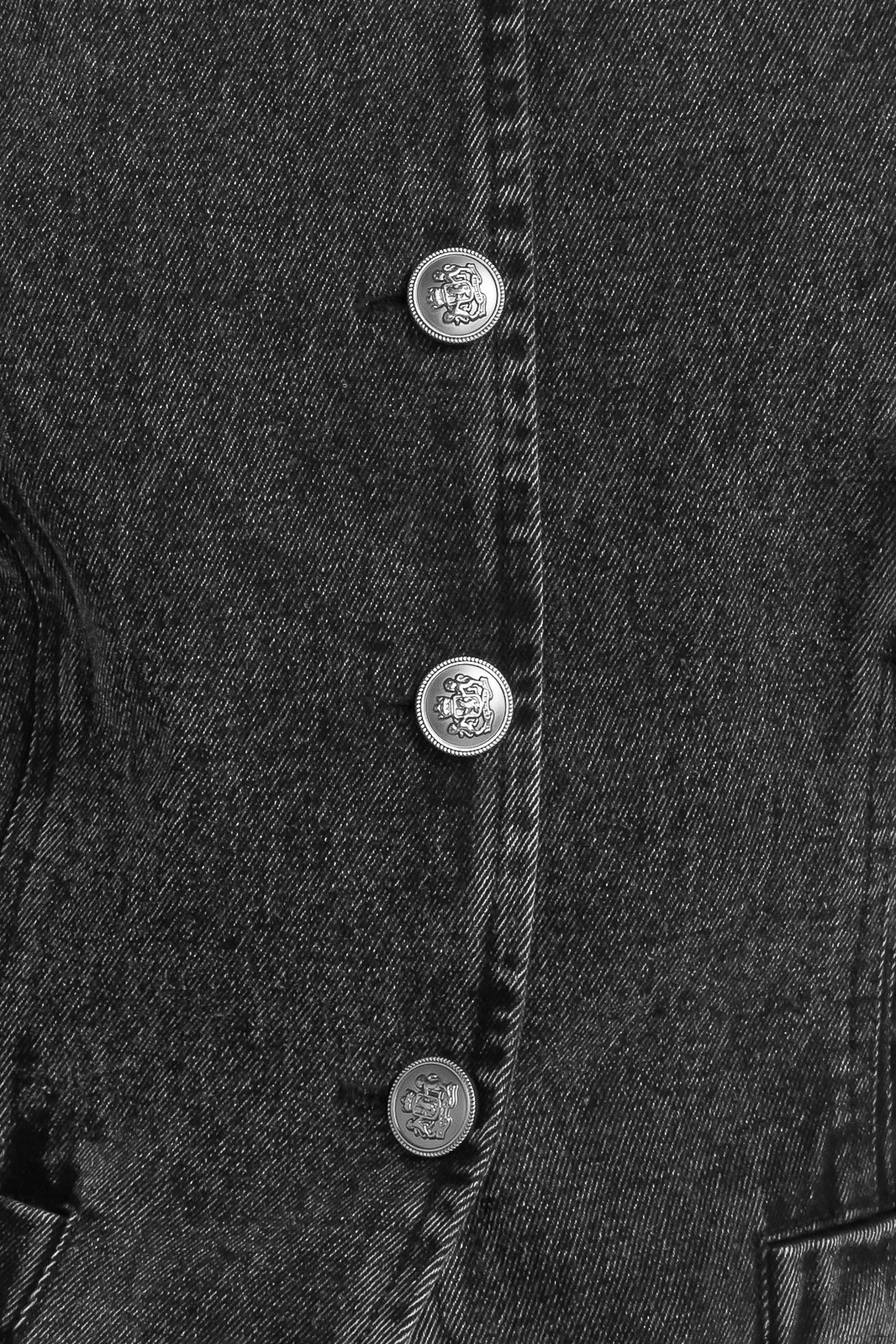 A washed denim jacket featuring round neckline and front button closure with pockets.