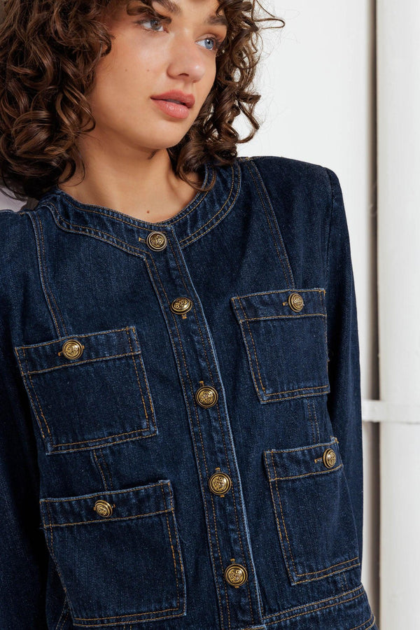 A washed denim jacket with round neck, button down and pockets