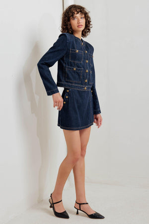 A washed denim jacket with round neck, button down and pockets