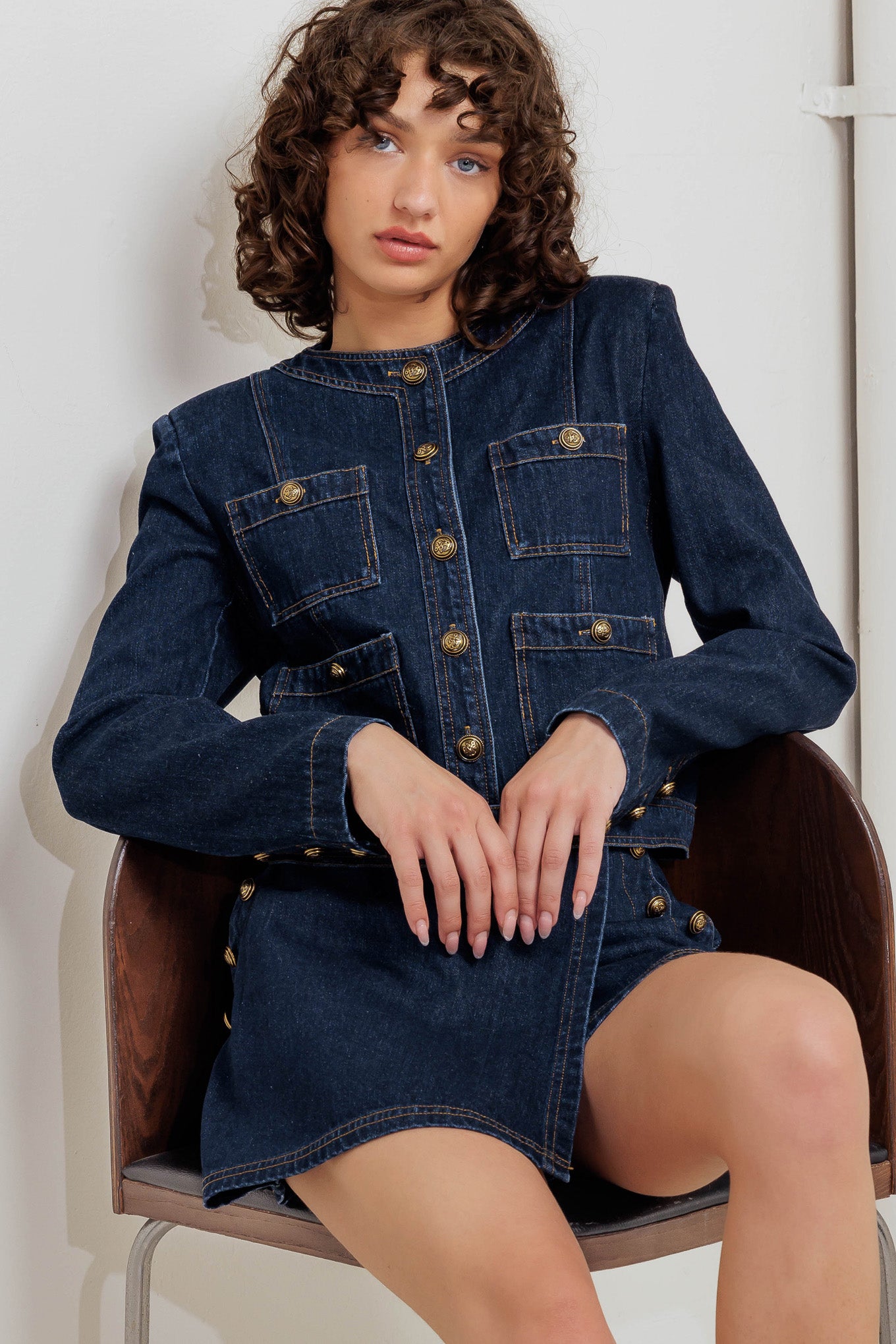 A washed denim jacket with round neck, button down and pockets