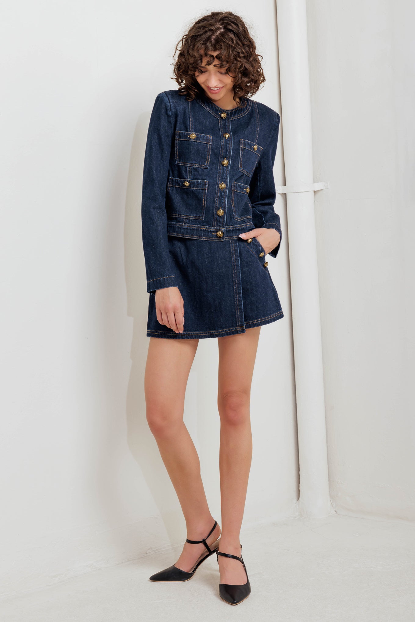A washed denim jacket with round neck, button down and pockets