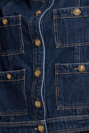A washed denim jacket with round neck, button down and pockets
