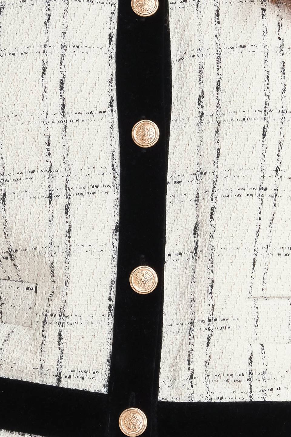 A woven tweed crop jacket featuring round neckline, long sleeve, contrasting hem and front button closure