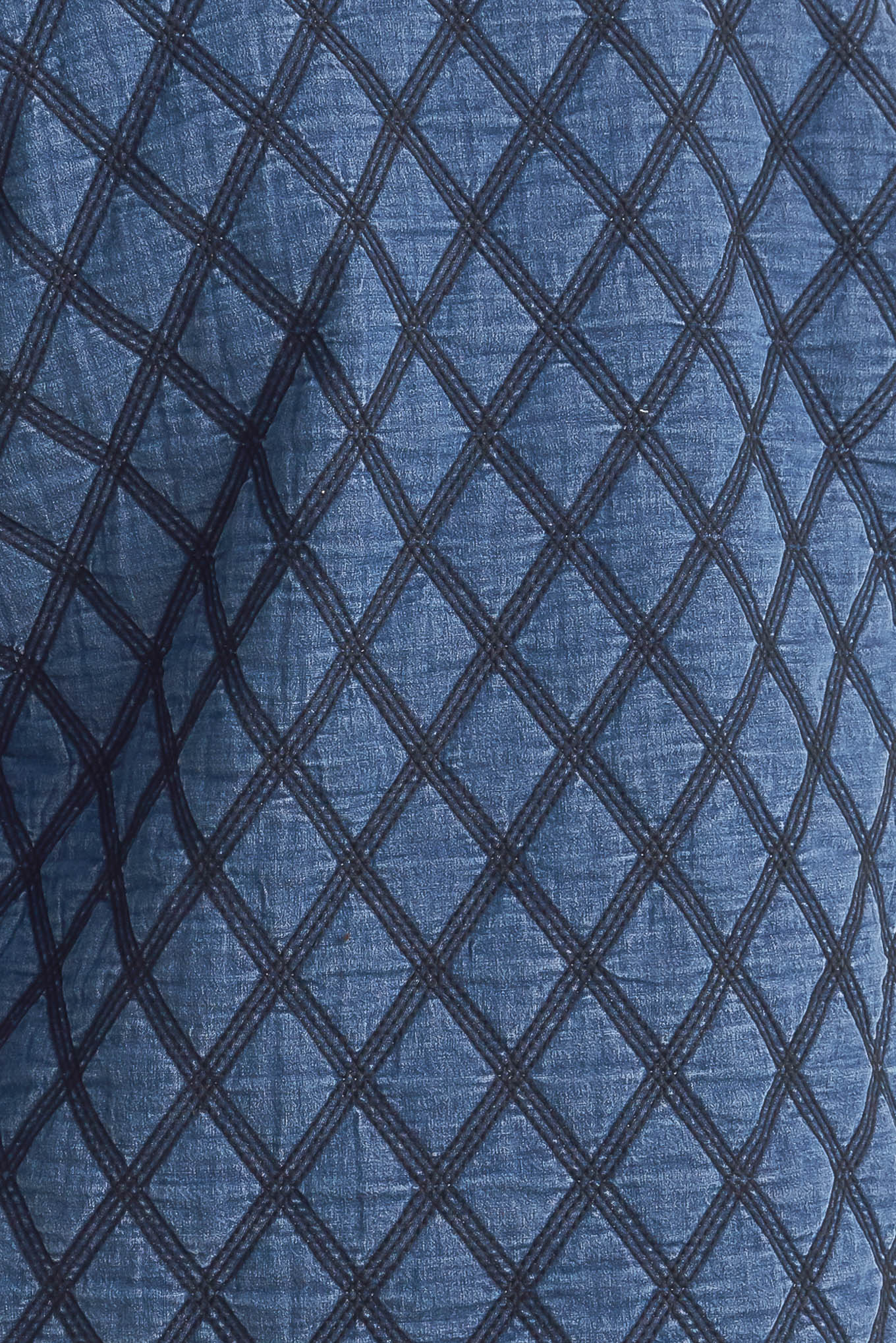 A quilted woven jacket featuring round neckline, long sleeve and front button down.