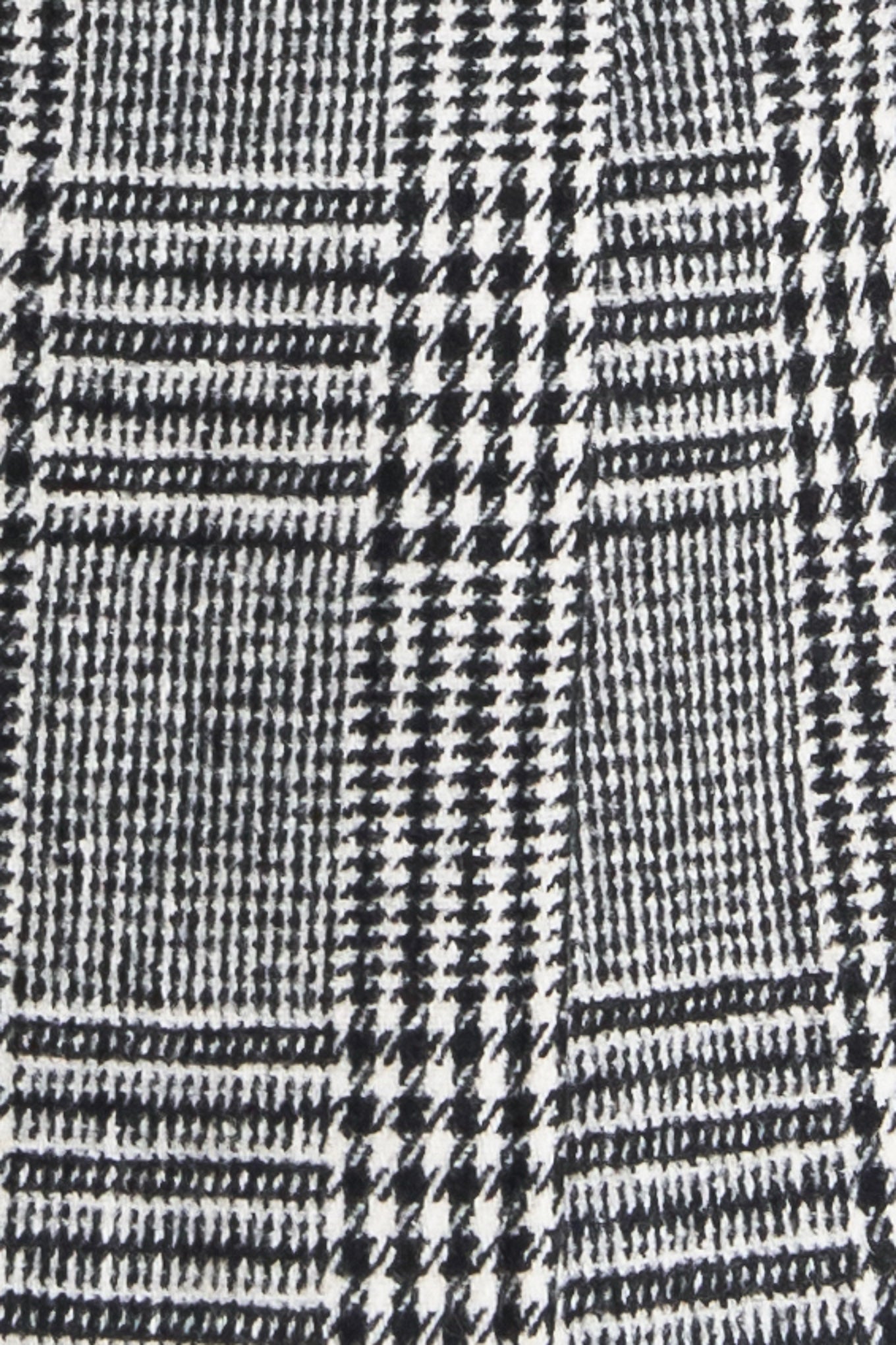 A woolen woven plaid jacket with front closure.