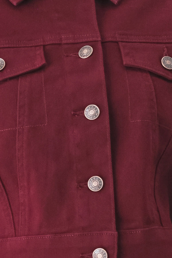 Woman wearing a burgundy short sleeve twill jacket with front button closure | FREEMARKET