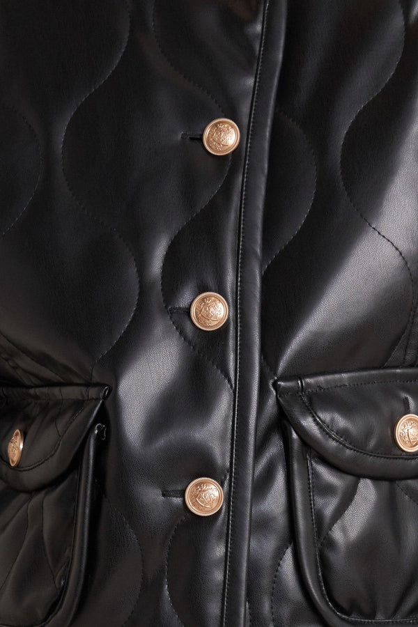 A quilted faux leather jacket with front pockets and button down closure.