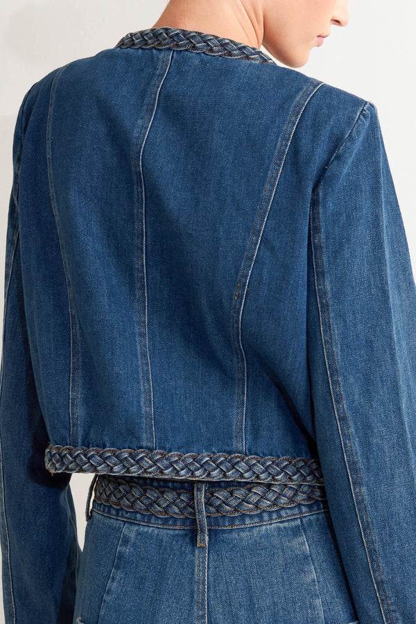 A washed denim jacket featuring round neckline, braided trim and hook &amp; eye closure