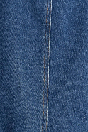 A washed denim jacket featuring round neckline, braided trim and hook &amp; eye closure