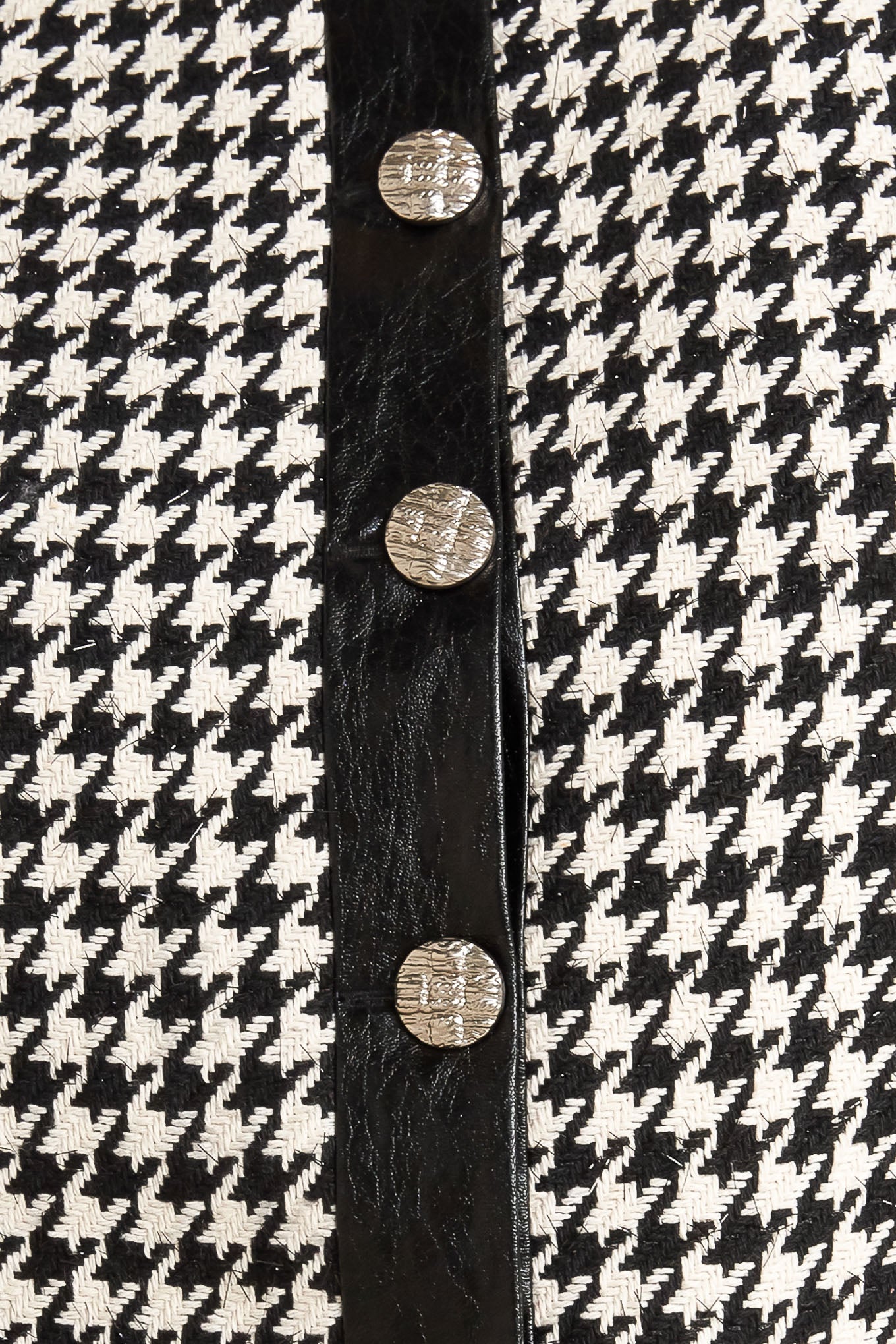 A tweed jacket featuring round collar, front button down, long sleeve and faux leather edge