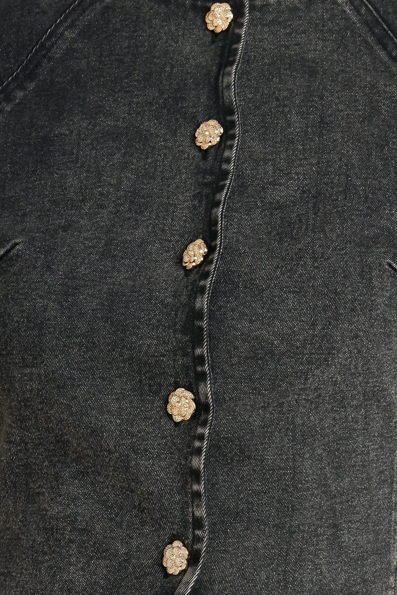 A washed denim jacket featuring round neckline, short sleeve and front button down closure. 
